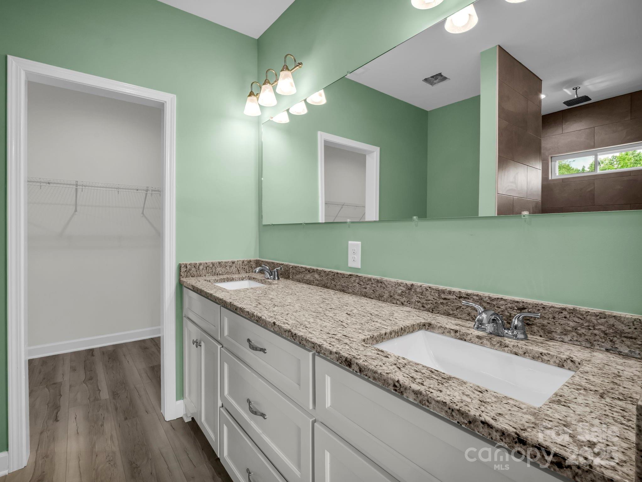 174 Charlie Randall Road Lawndale, NC 28090 - Photo 24 of 41 a bathroom with a sink and a mirror