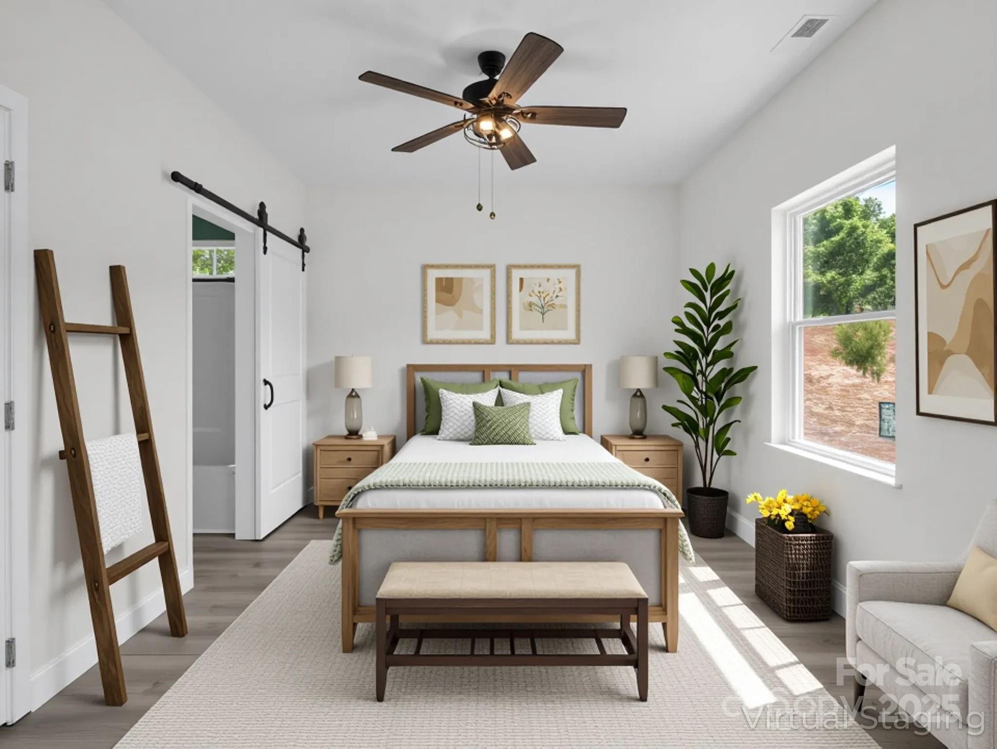 174 Charlie Randall Road Lawndale, NC 28090 - Photo 29 of 41 a bedroom with a bed and a chandelier