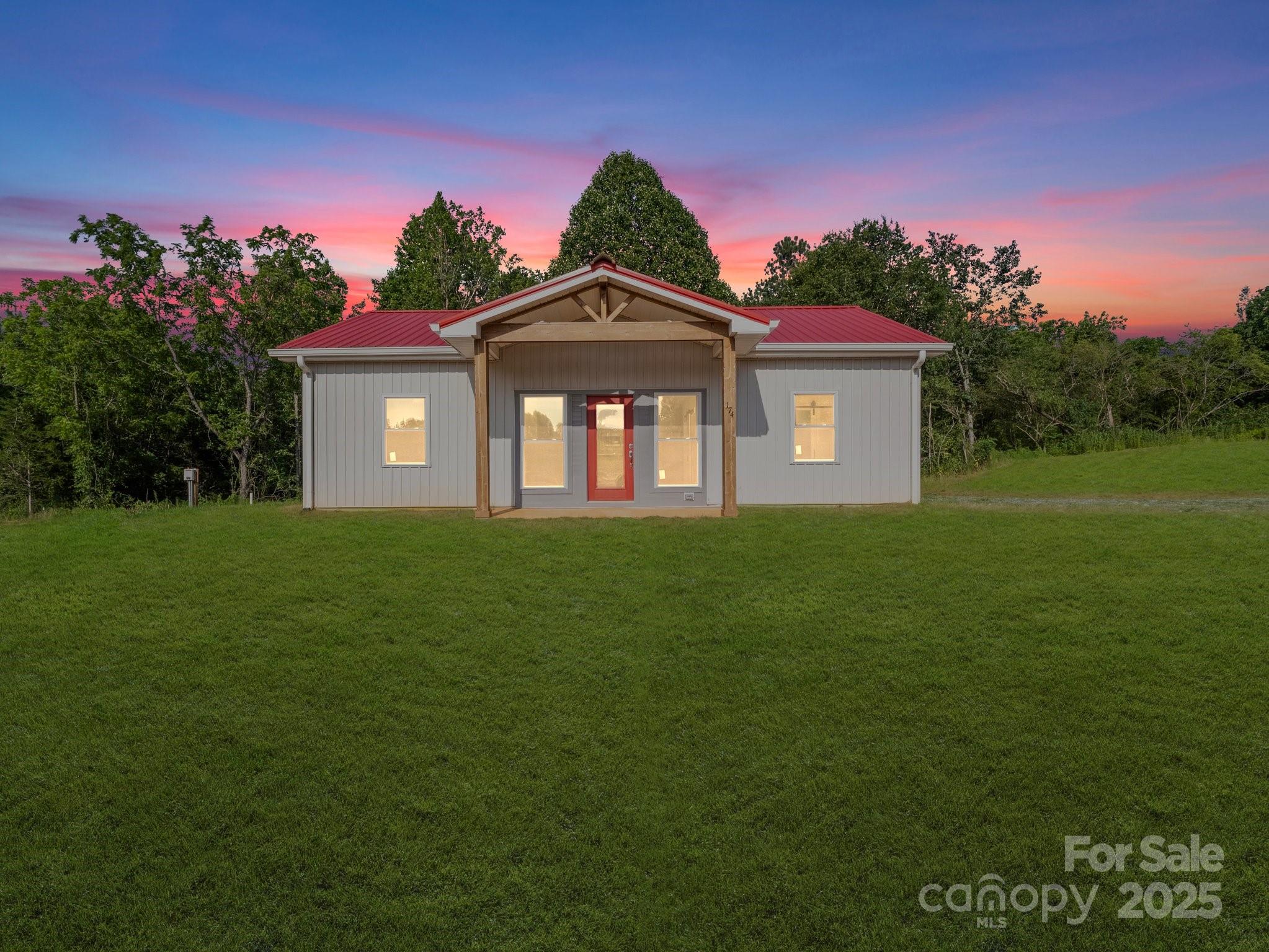 174 Charlie Randall Road Lawndale, NC 28090 - Photo 38 of 41 a front view of a house with a garden
