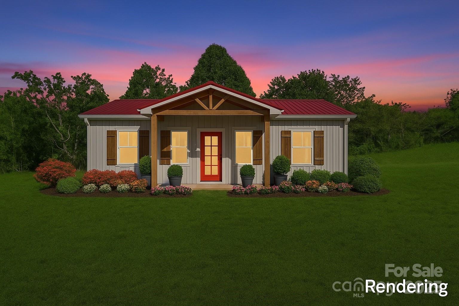 174 Charlie Randall Road Lawndale, NC 28090 - Photo 39 of 41 a front view of a house with a garden