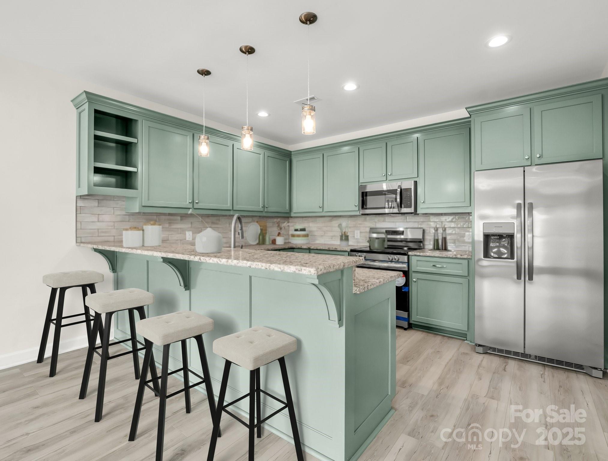 174 Charlie Randall Road Lawndale, NC 28090 - Photo 6 of 41 a kitchen with kitchen island a sink stove and refrigerator