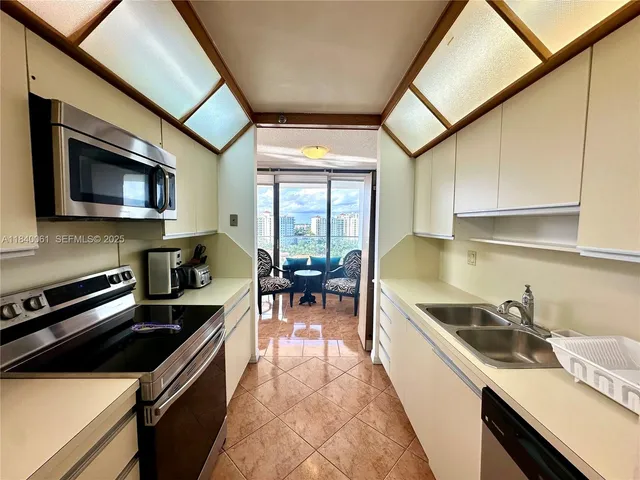 a spacious bathroom with a vanity and a mirror