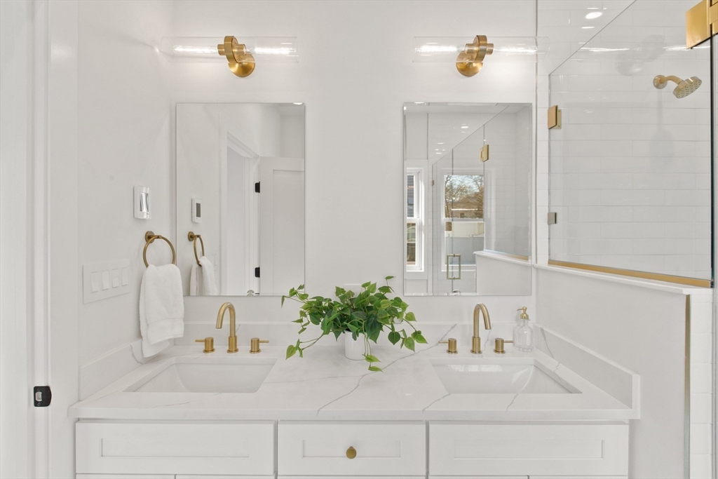 28 Sutherland Road, Unit 28 Arlington, MA 02476 - Photo 23 of 40 a bathroom with a sink and a mirror
