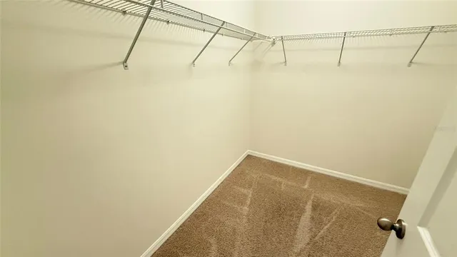 a bathroom with a granite countertop sink a mirror and a shower