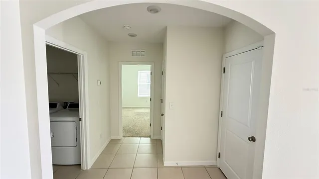 a view of a hallway with a room