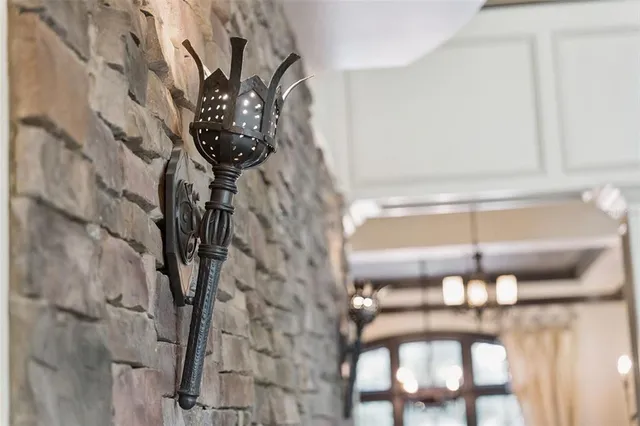 a spacious bedroom with a bed and a flat screen tv