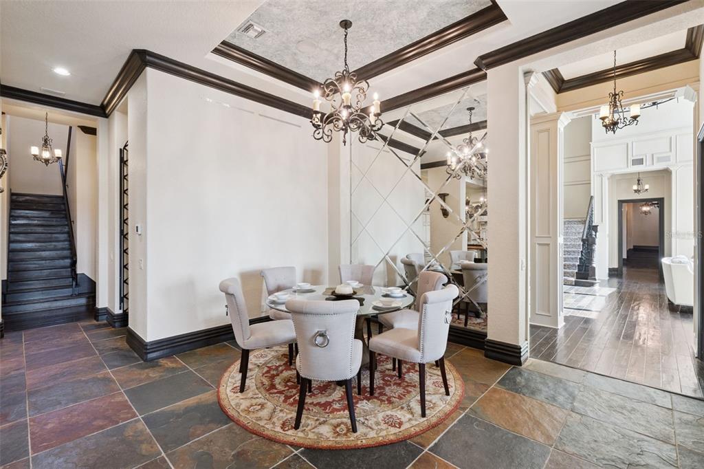 6507 Rosella Court Windermere, FL 34786 - Photo 17 of 92 a dining room with furniture and a chandelier