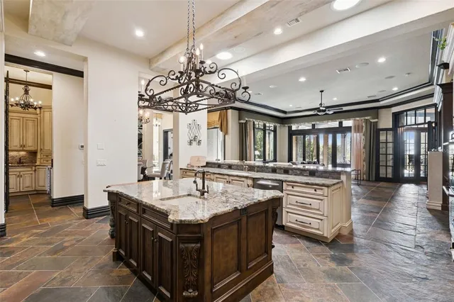 a bathroom with a granite countertop bathtub and shower