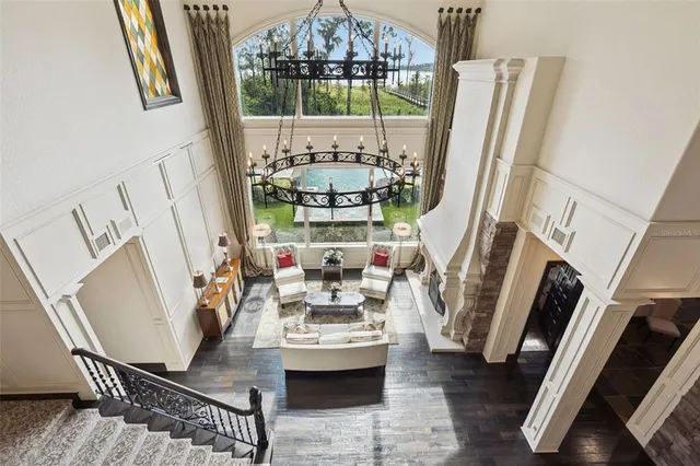 a view of staircase with white walls and a window