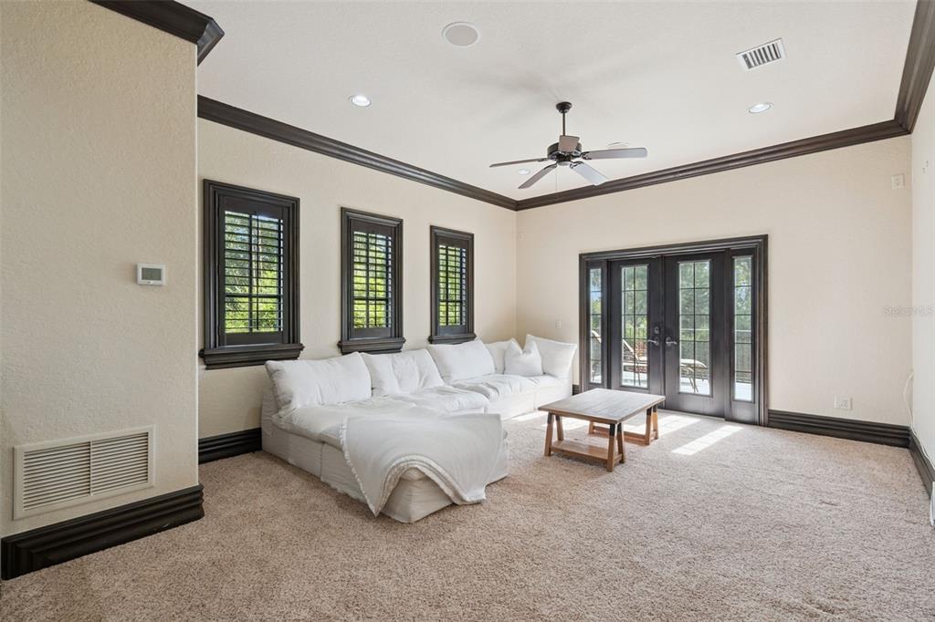 6507 Rosella Court Windermere, FL 34786 - Photo 45 of 92 a living room with furniture ceiling fan and a window