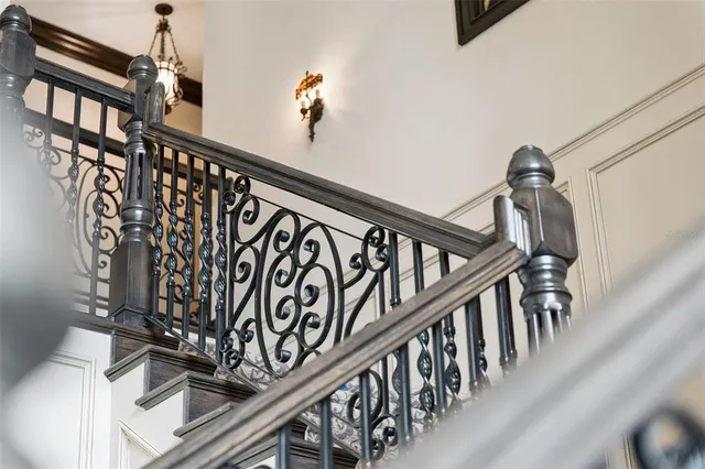 a view of a chairs and table in the balcony