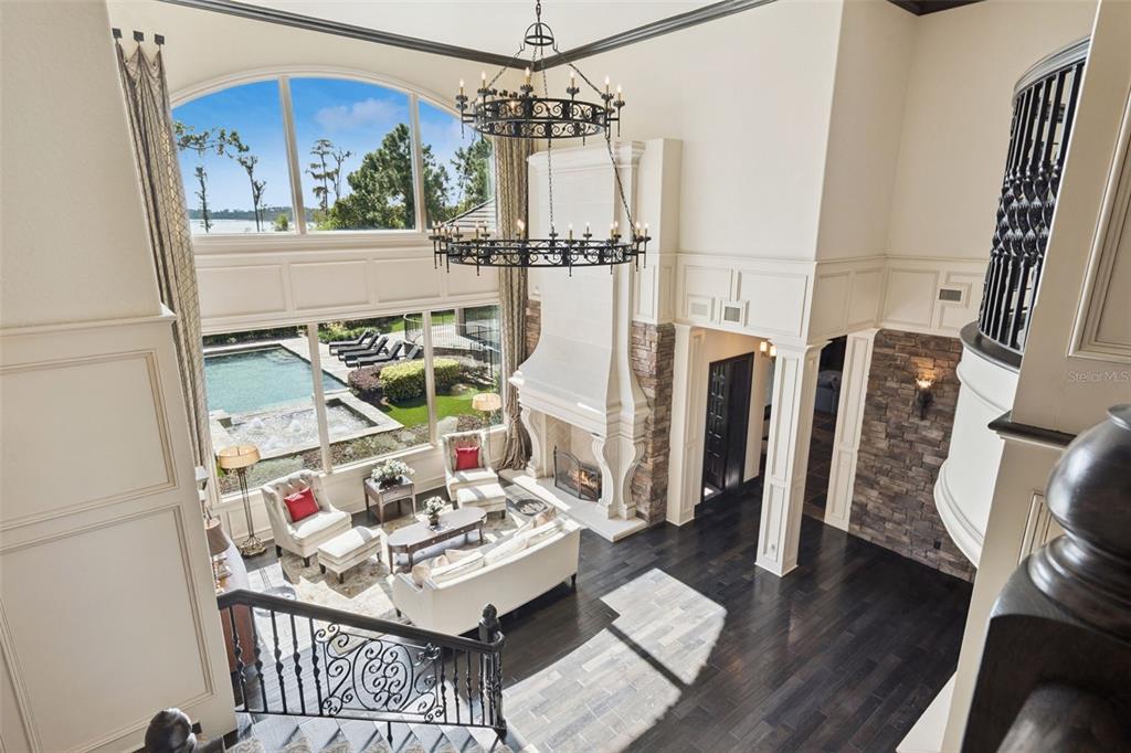 6507 Rosella Court Windermere, FL 34786 - Photo 47 of 92 a view of a dining room with furniture one side kitchen view and wooden floor