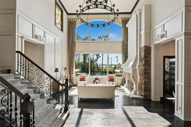 a view of a room with window wooden floor and chandelier