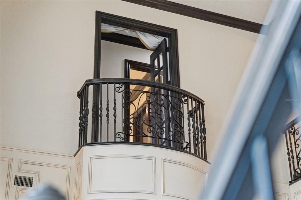 6507 Rosella Court Windermere, FL 34786 - Photo 63 of 92 a view of staircase with white walls and a window