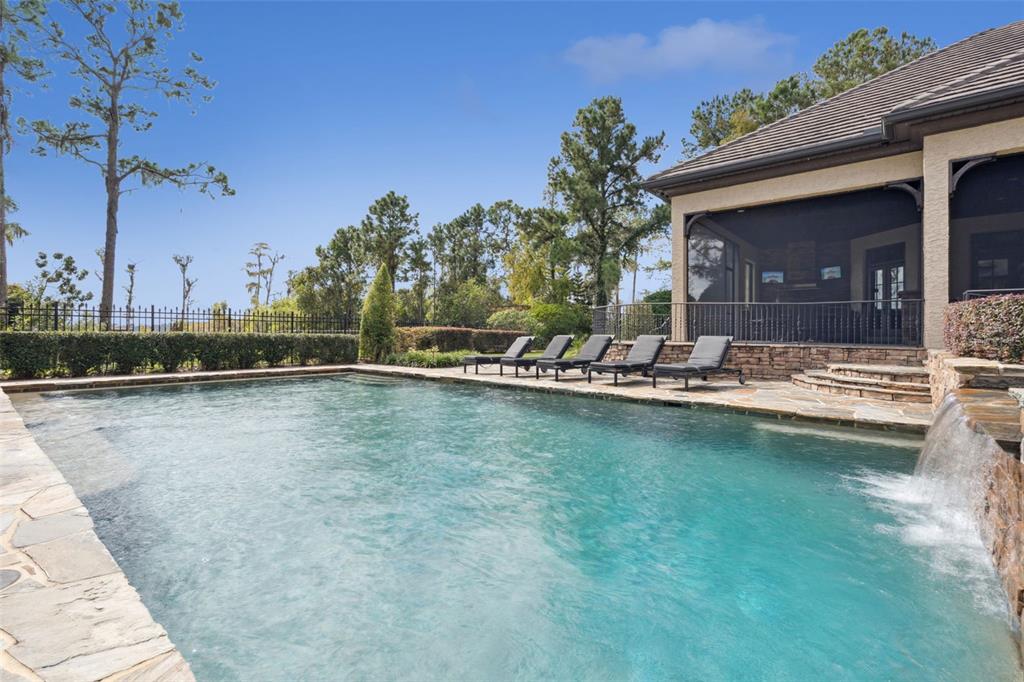 6507 Rosella Court Windermere, FL 34786 - Photo 80 of 92 a view of a swimming pool with outdoor seating