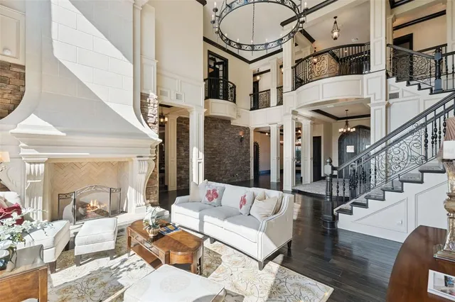 a spacious bathroom with a granite countertop sink a mirror and a shower