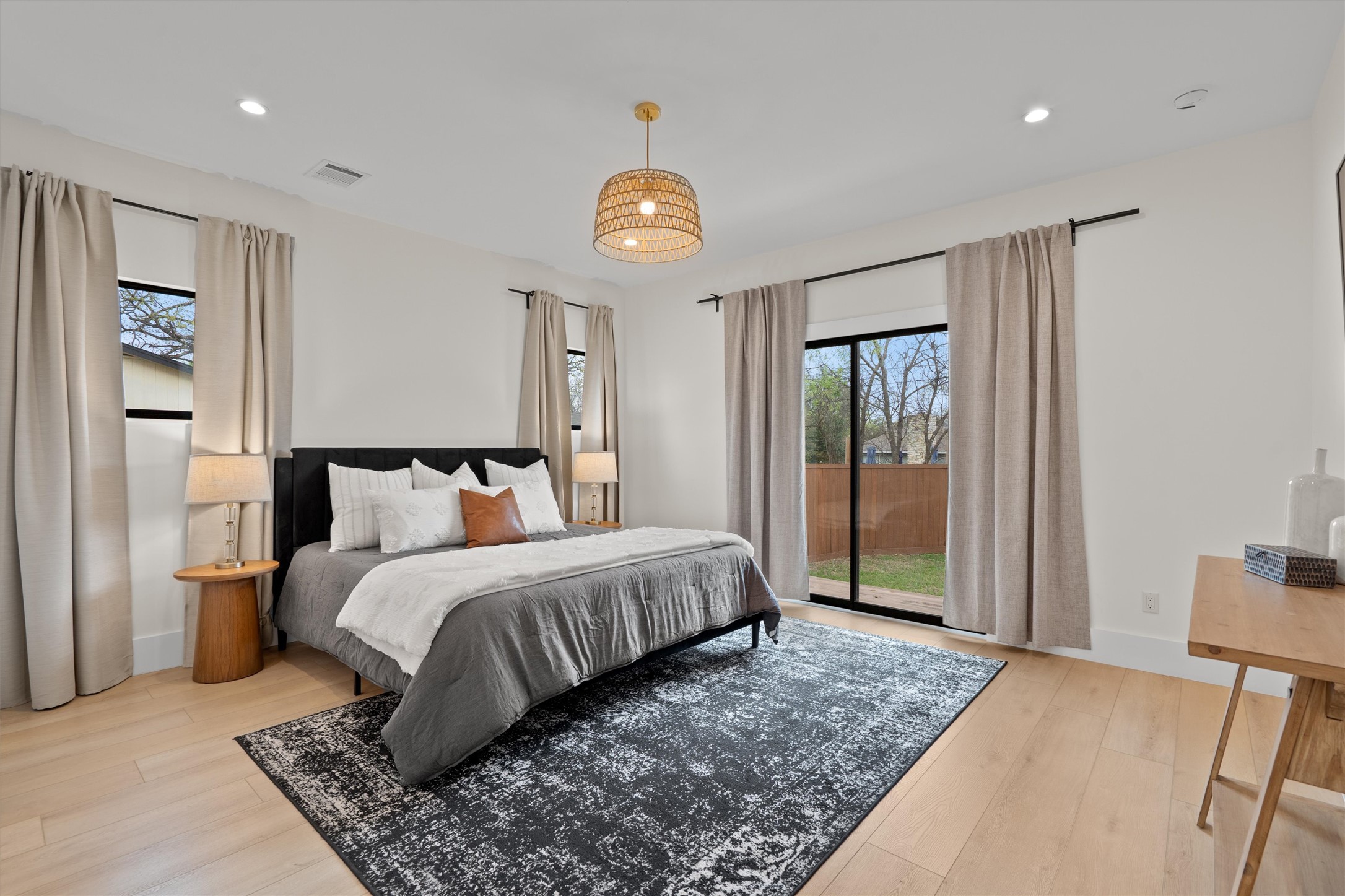 1108 Dunman Drive Georgetown, TX 78628 - Photo 19 of 40 a bedroom with a bed and a lamp on table