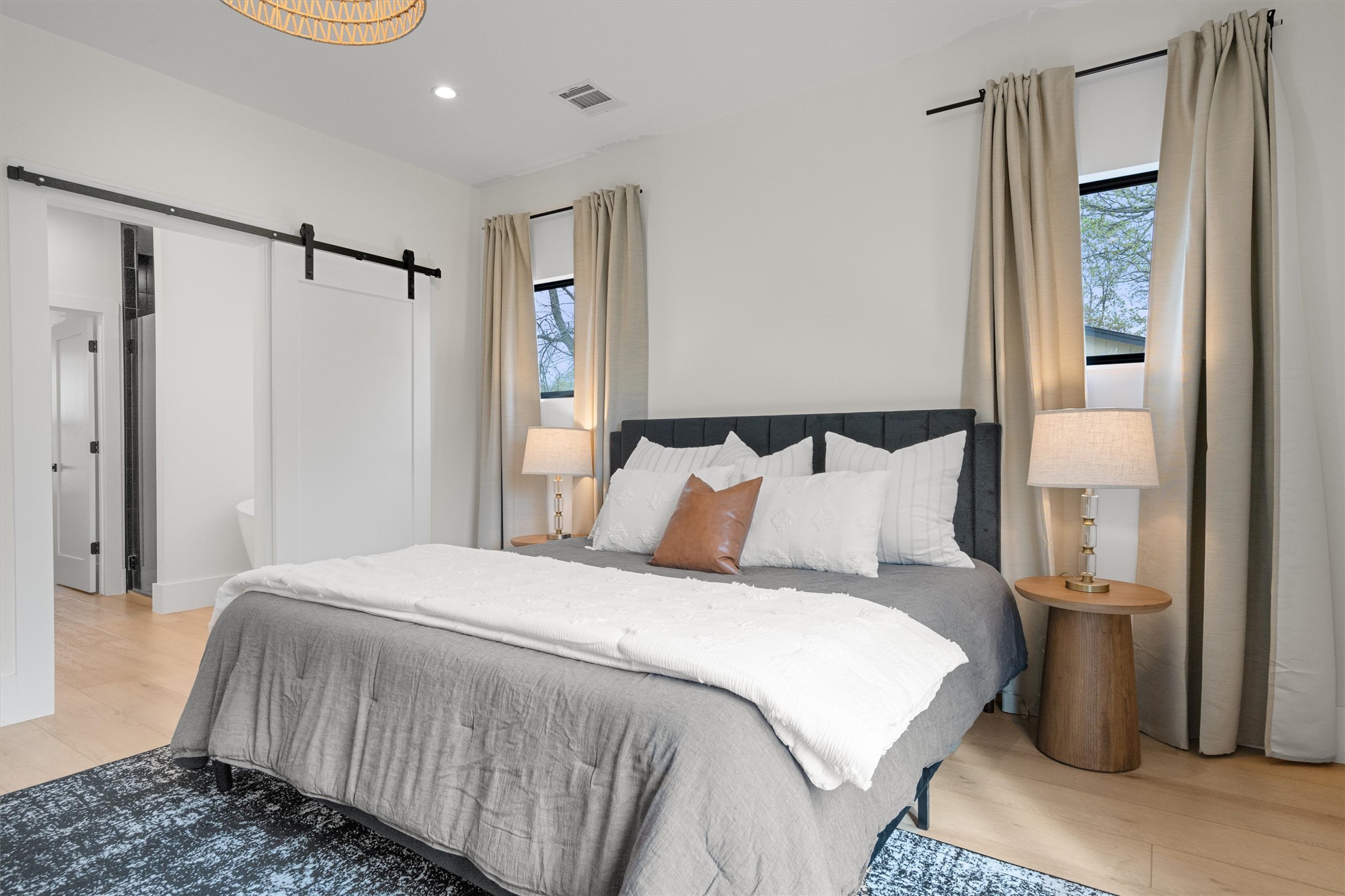 1108 Dunman Drive Georgetown, TX 78628 - Photo 20 of 40 a bedroom with a bed and a mirror