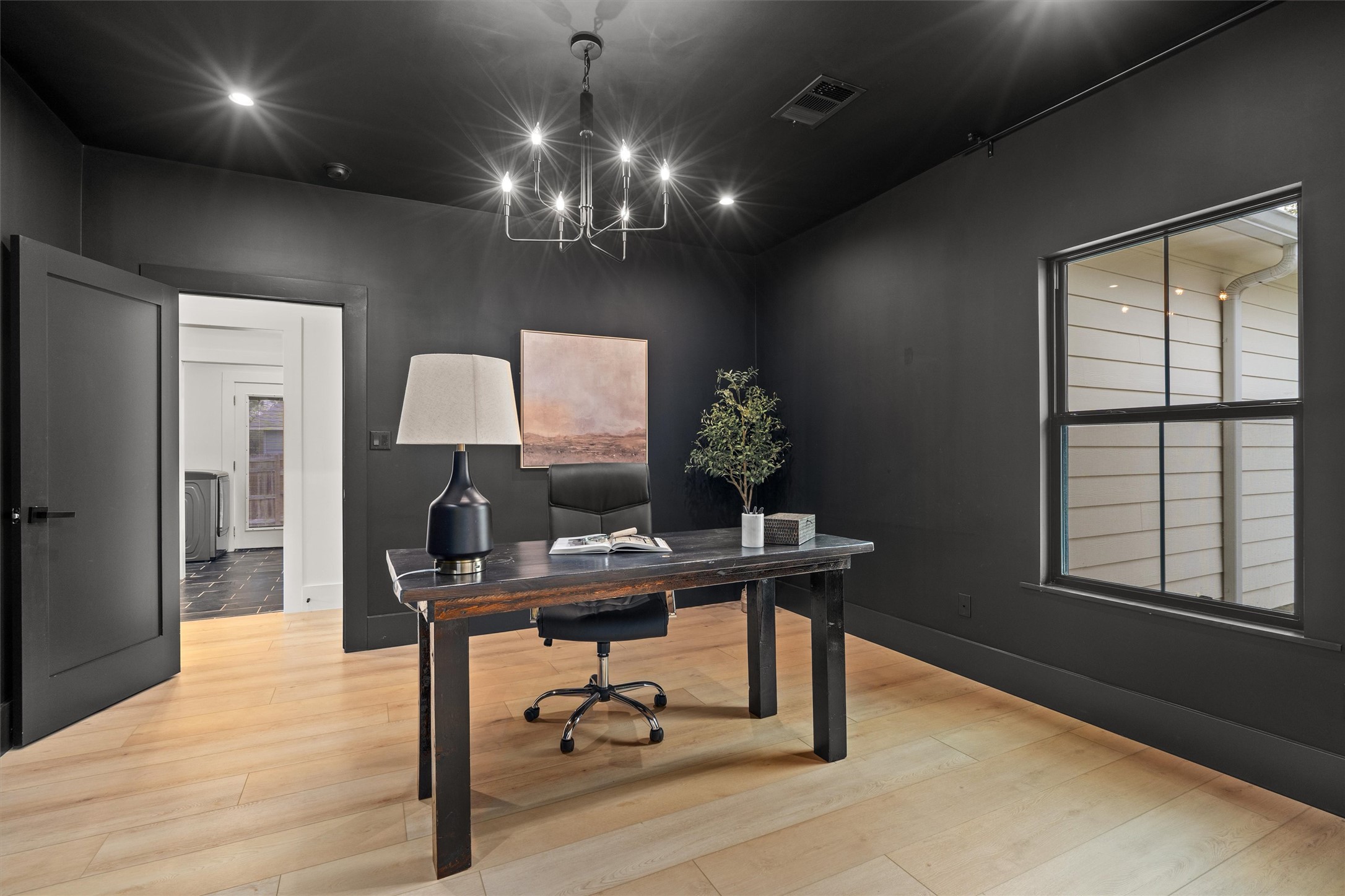 1108 Dunman Drive Georgetown, TX 78628 - Photo 5 of 40 a view of a workspace with furniture and a window