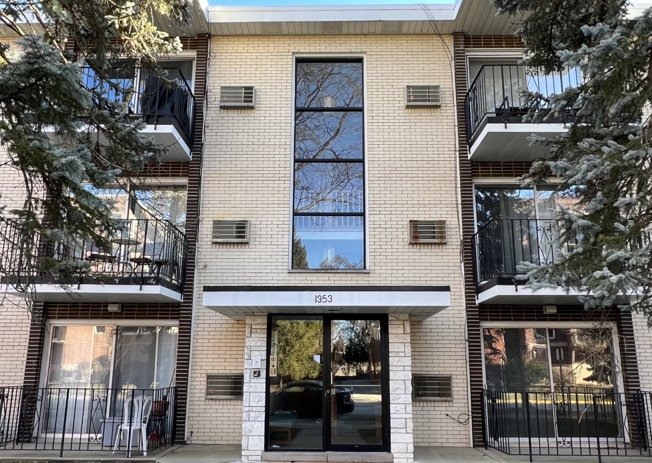 a front view of a house with glass windows