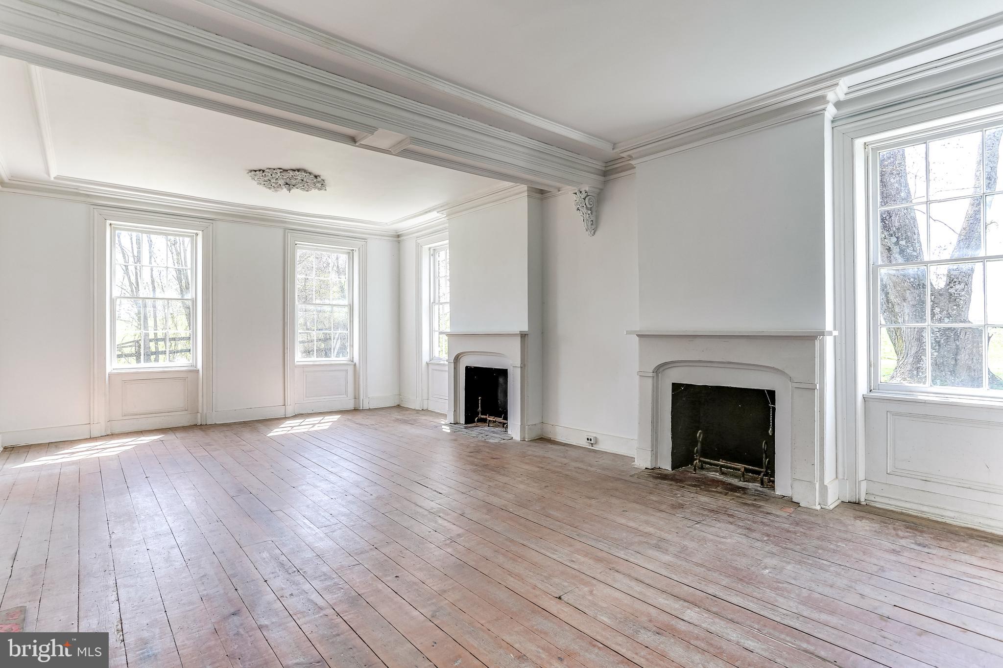 412 Old Bachmans Valley Road Westminster, MD 21157 - Photo 21 of 52 First level double parlor with dual fireplaces
