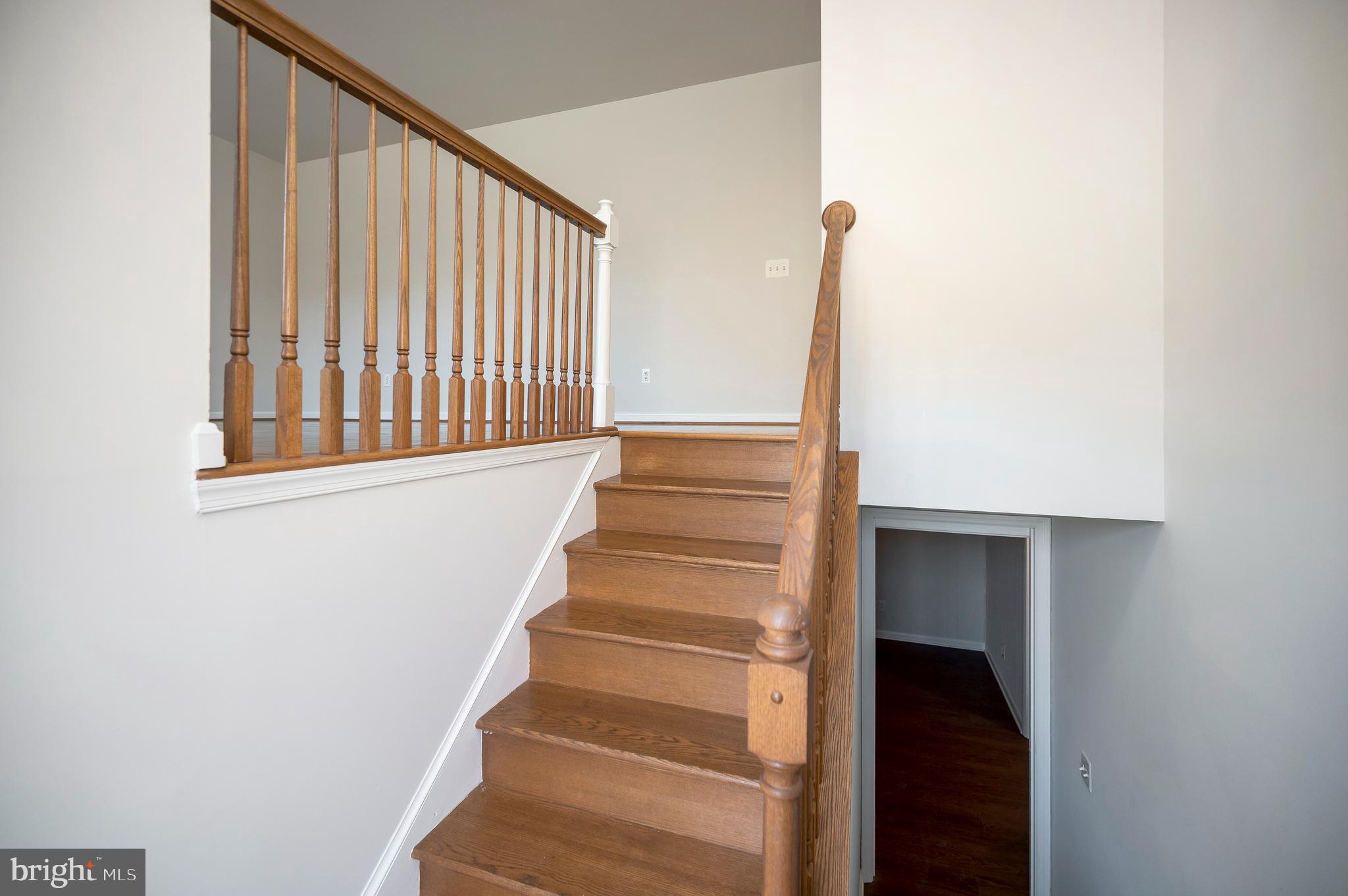 48 Belle Plains Road Fredericksburg, VA 22405 - Photo 13 of 51 a view of staircase with white walls and a window