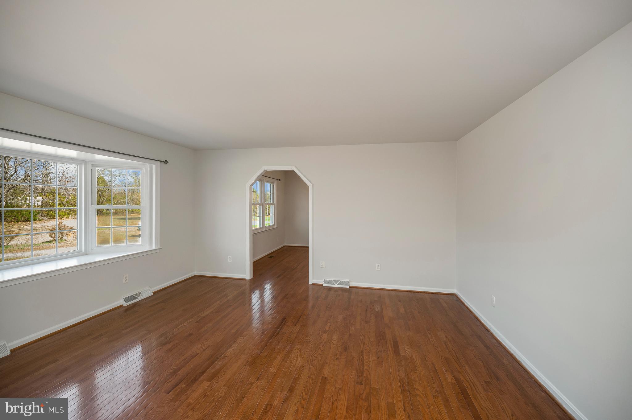 48 Belle Plains Road Fredericksburg, VA 22405 - Photo 15 of 51 an empty room with wooden floor and windows