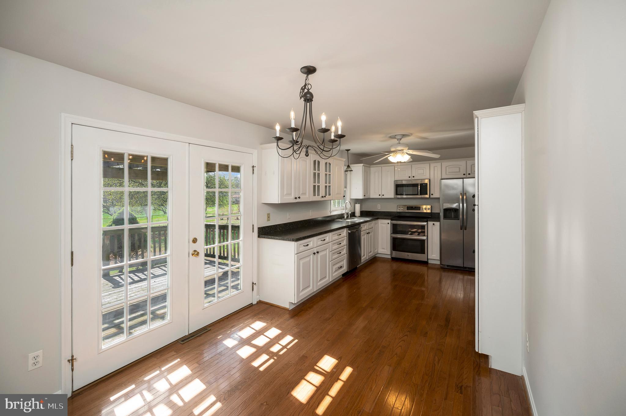 48 Belle Plains Road Fredericksburg, VA 22405 - Photo 25 of 51 a large kitchen with cabinets a sink and stainless steel appliances
