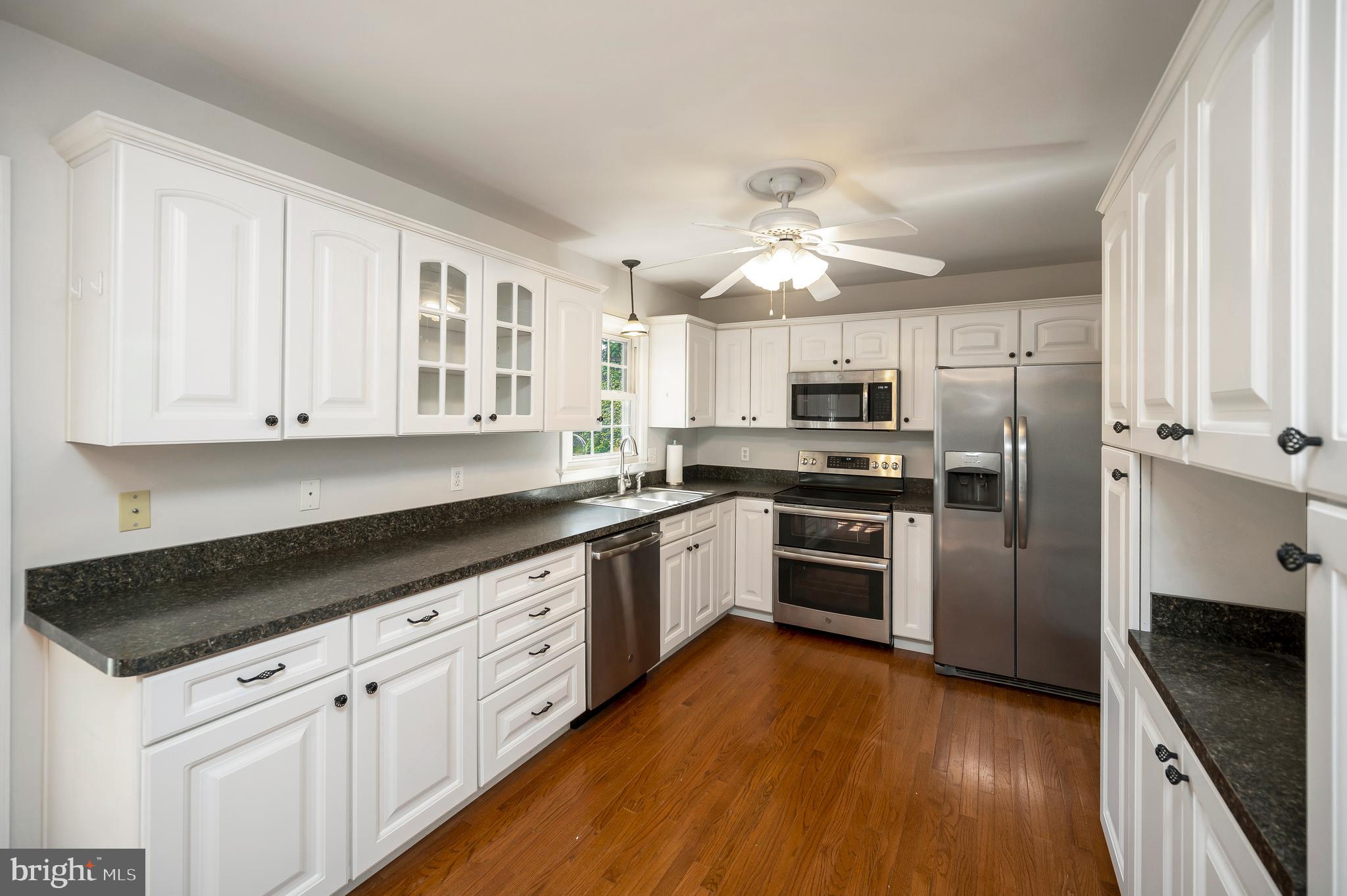 48 Belle Plains Road Fredericksburg, VA 22405 - Photo 28 of 51 a kitchen with granite countertop a refrigerator oven a sink and dishwasher