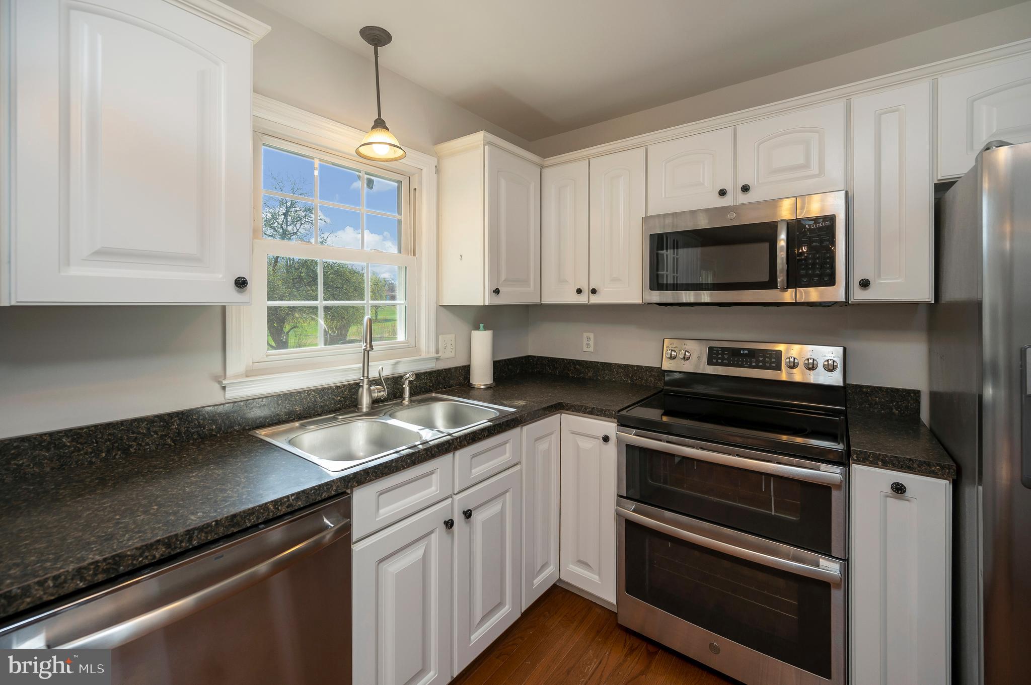 48 Belle Plains Road Fredericksburg, VA 22405 - Photo 31 of 51 a kitchen with granite countertop a sink and cabinets