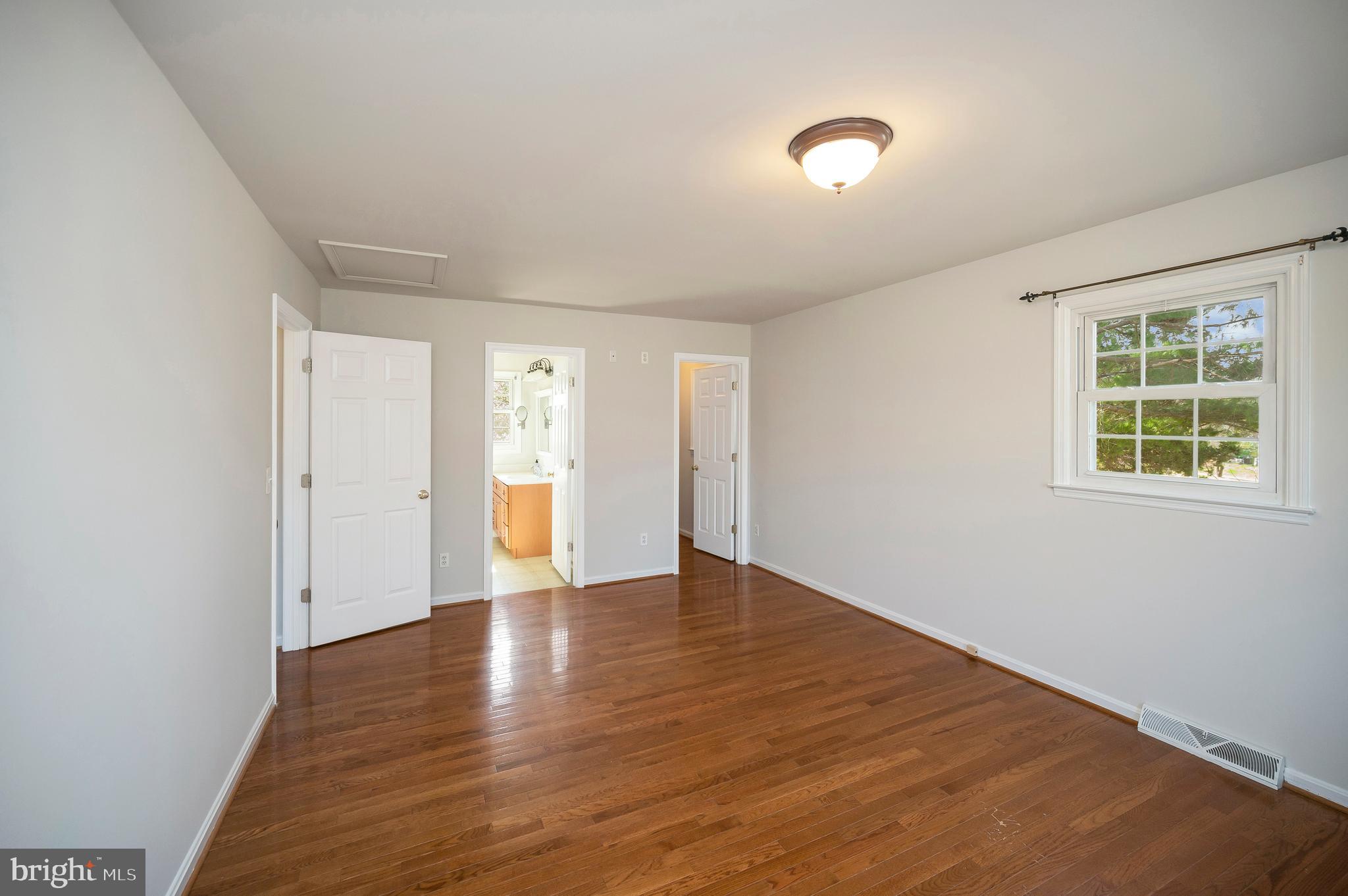 48 Belle Plains Road Fredericksburg, VA 22405 - Photo 34 of 51 a view of an empty room with wooden floor and a window
