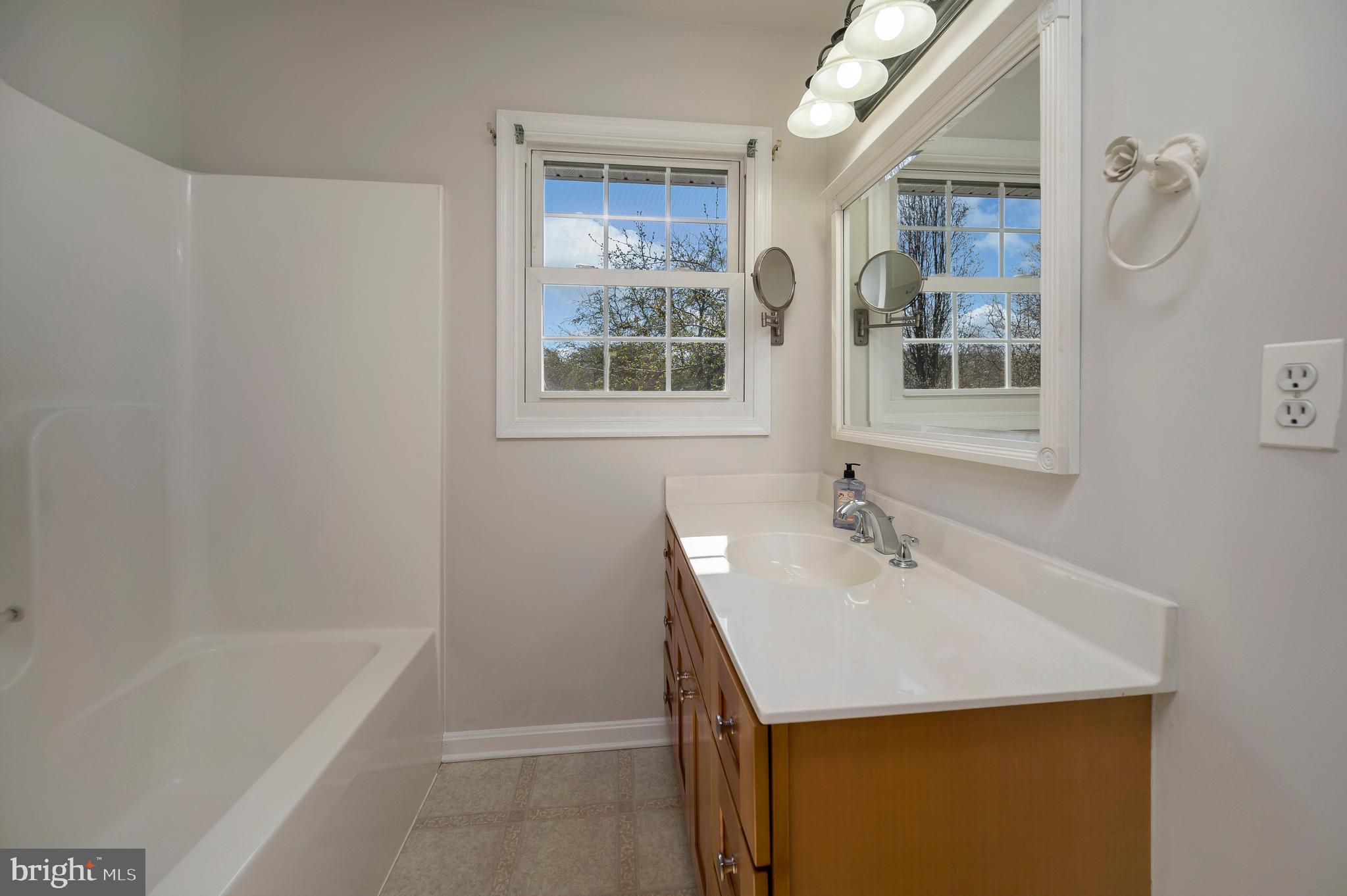 48 Belle Plains Road Fredericksburg, VA 22405 - Photo 36 of 51 a bathroom with a sink a bathtub and a shower