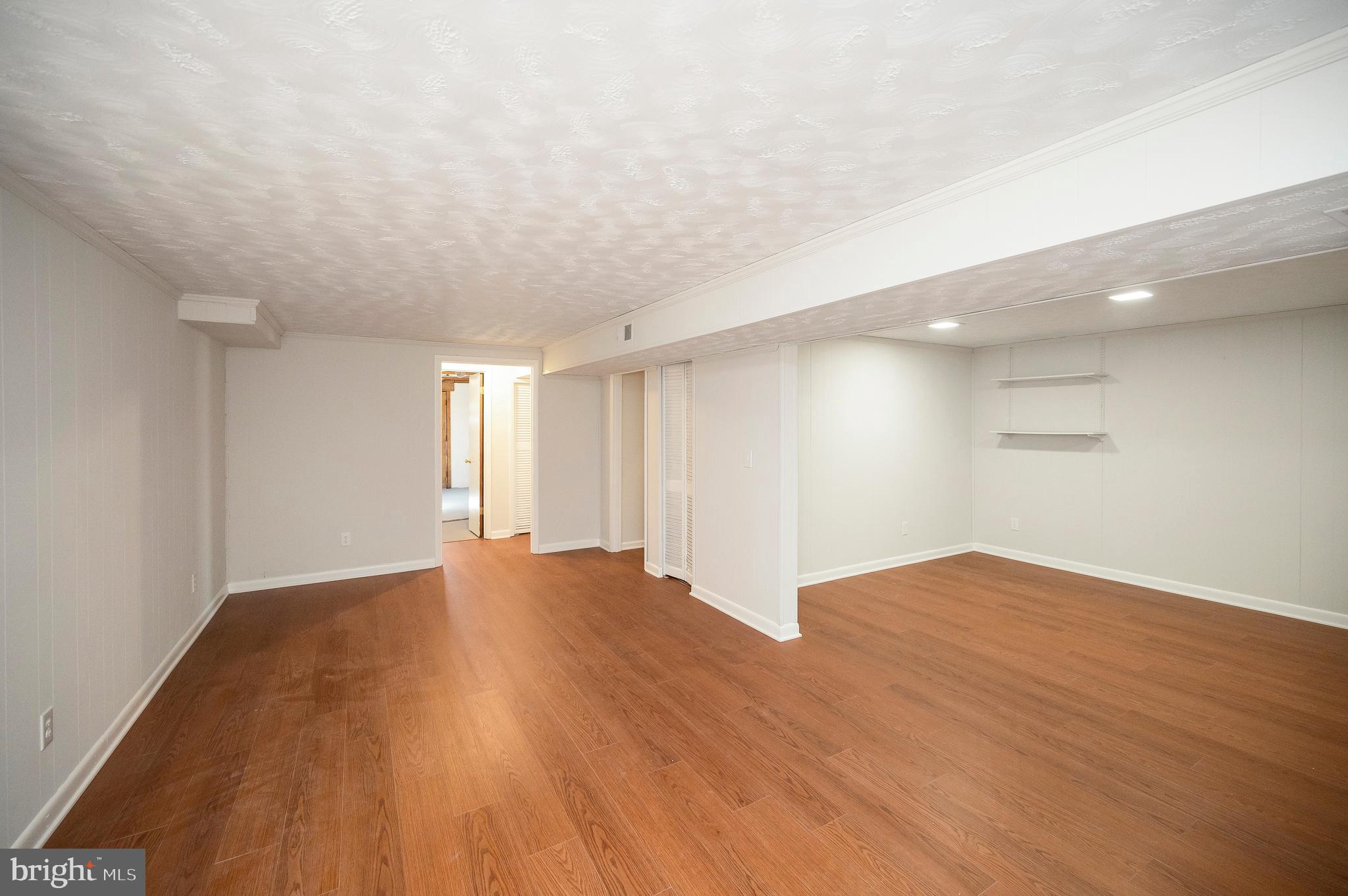 48 Belle Plains Road Fredericksburg, VA 22405 - Photo 44 of 51 a view of an empty room with wooden floor and a window