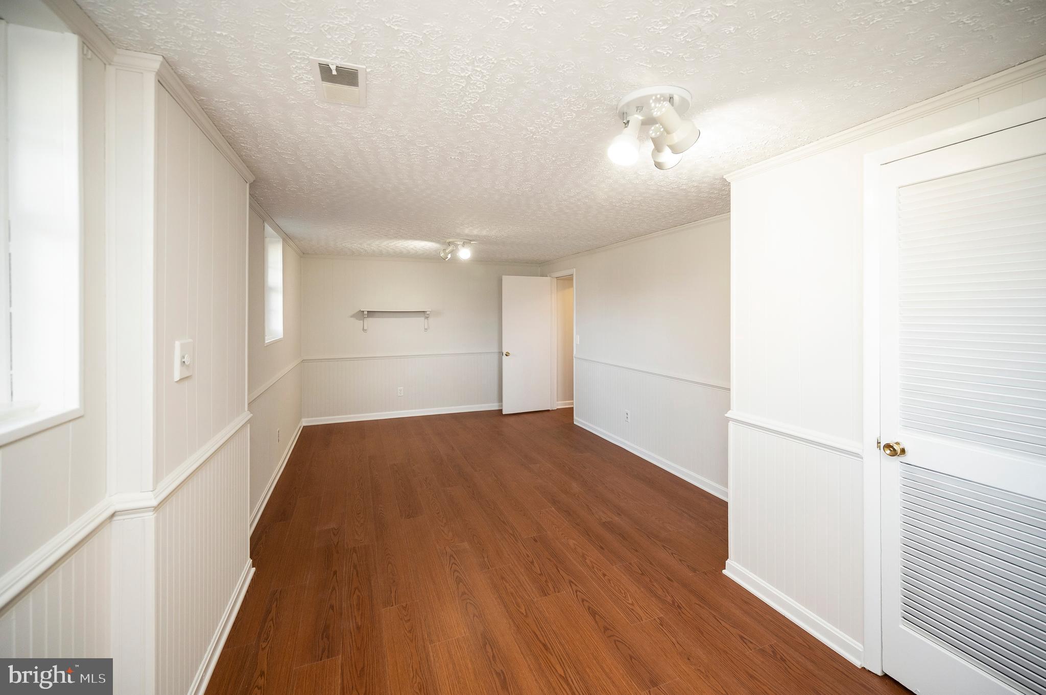 48 Belle Plains Road Fredericksburg, VA 22405 - Photo 47 of 51 a view of empty room with wooden floor
