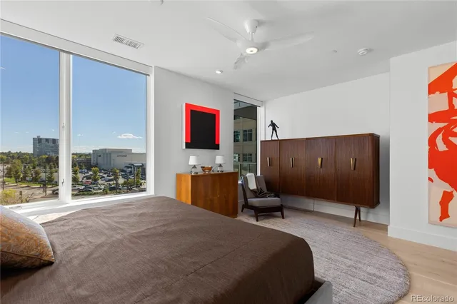 a bed room with a bed and a television