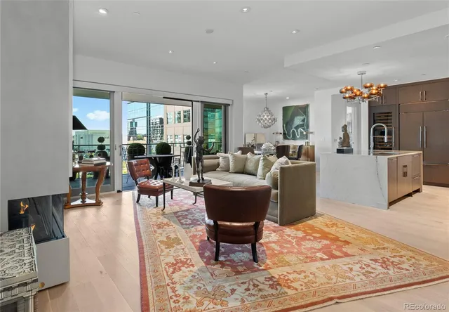 a living room with furniture windows and a flat screen tv