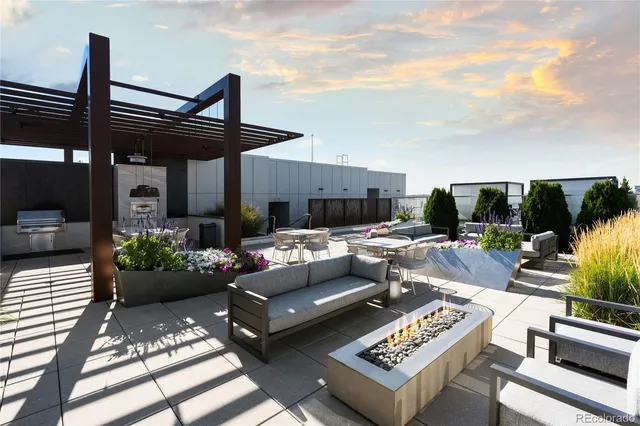 a view of a patio with couches and potted plants