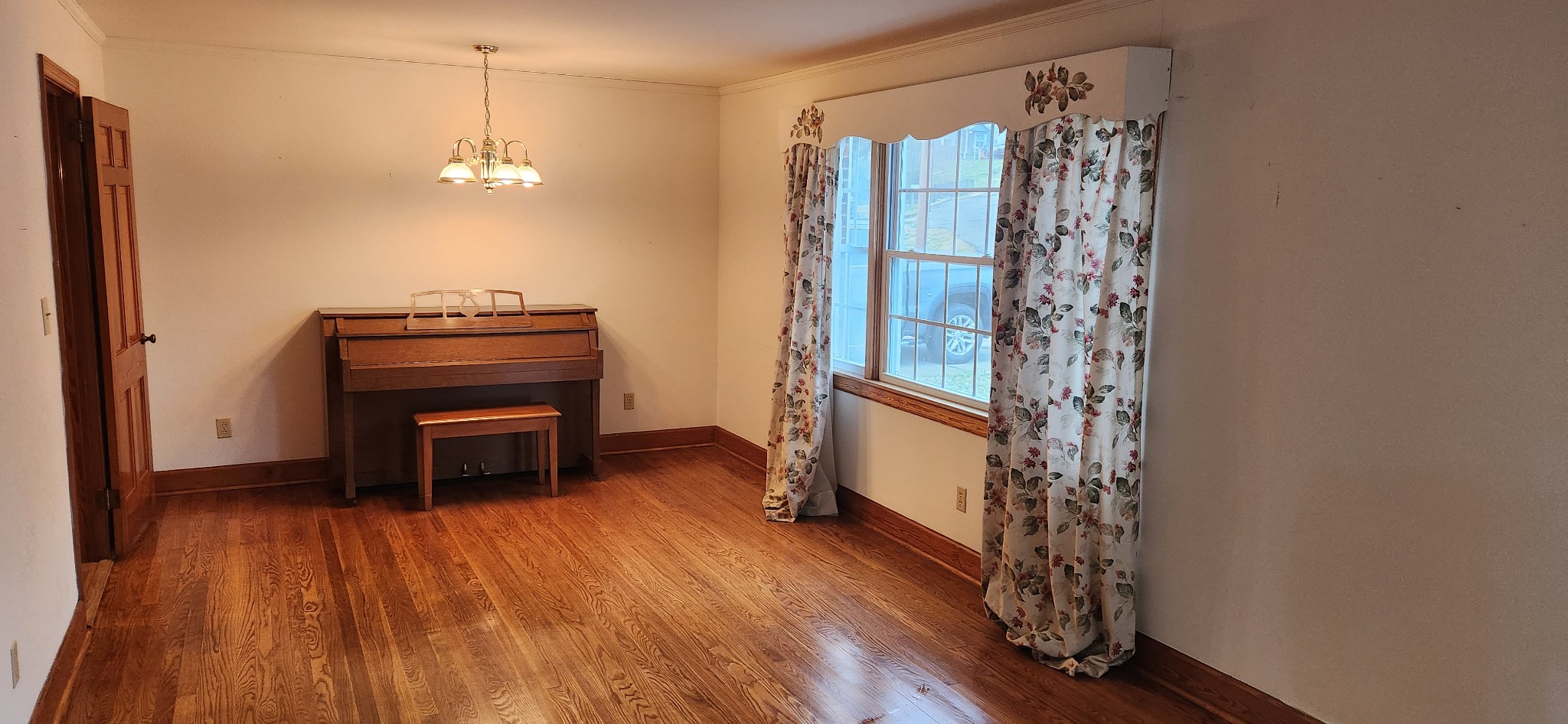 126 Riverside Drive Centerville, TN 37033 - Photo 9 of 19 a view of a room with window wooden floor and chandelier