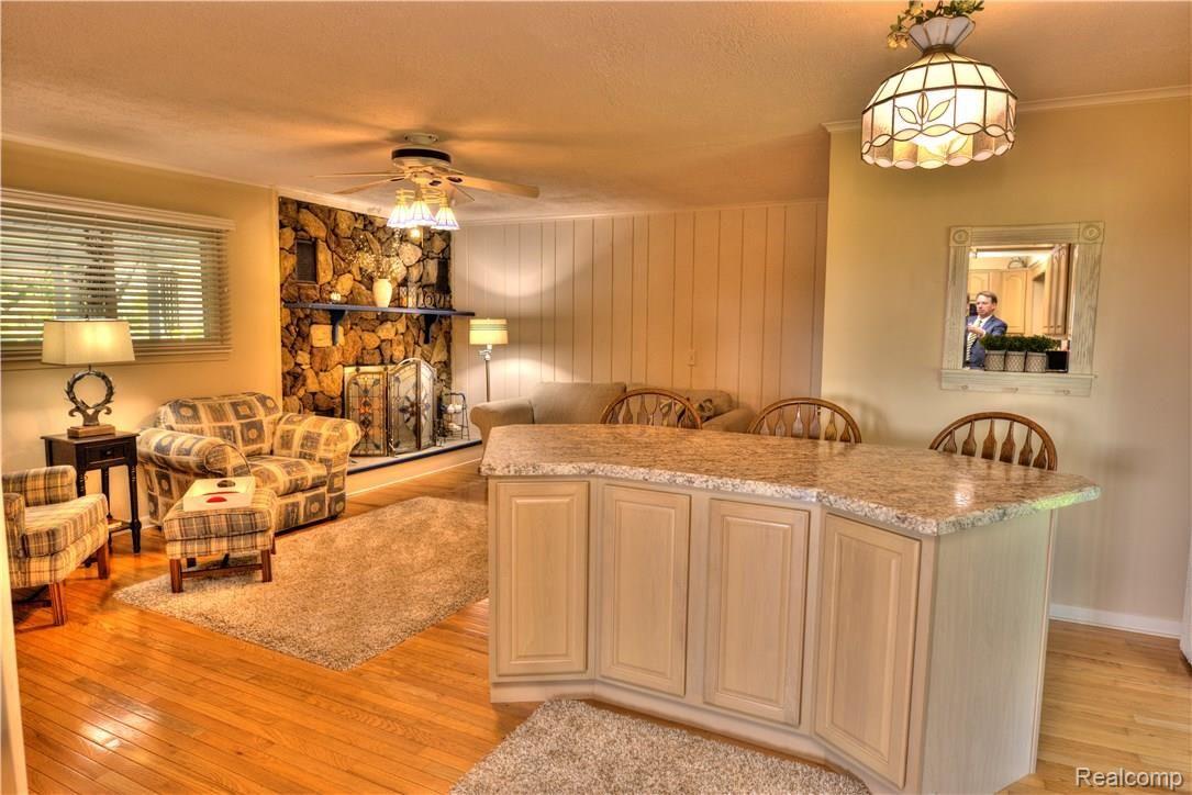 1289 North Seymour Road Flushing, MI 48433 - Photo 6 of 24 HDR Living Room FP Island Me in Mirror.jpg
