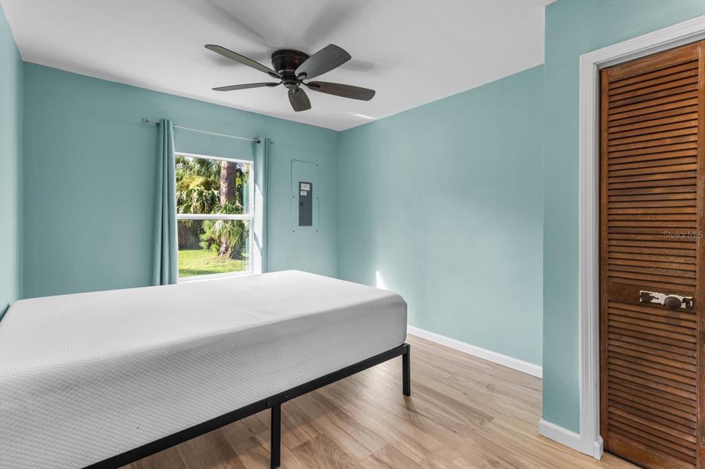 7 65th Street Yankeetown, FL 34498 - Photo 15 of 43 a bedroom with a bed and a window