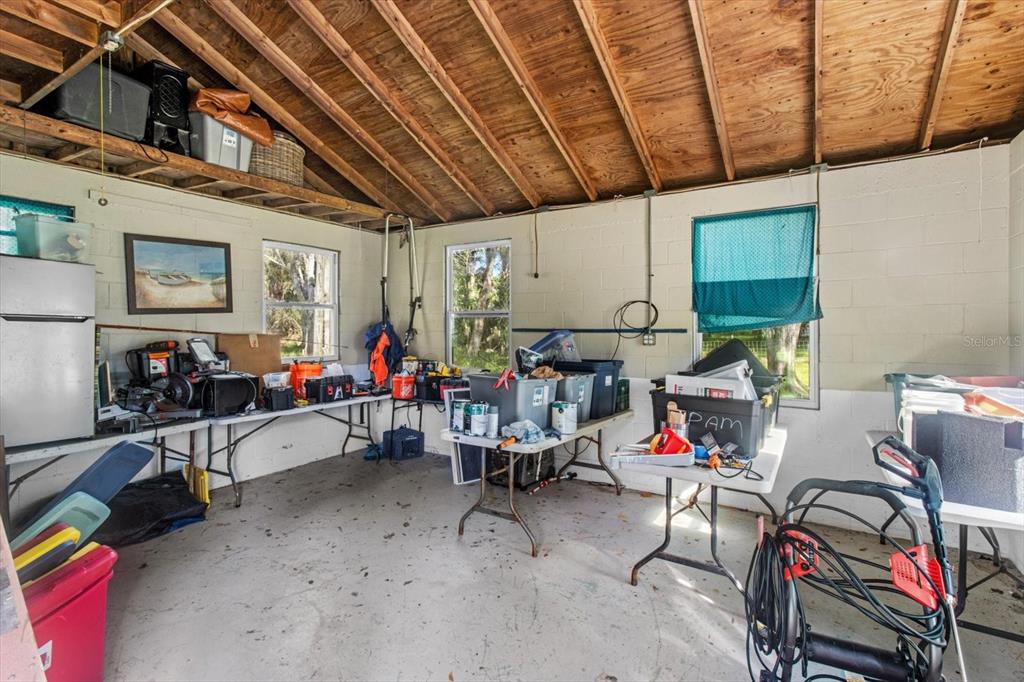 7 65th Street Yankeetown, FL 34498 - Photo 21 of 43 a living room with furniture a air conditioner and a window
