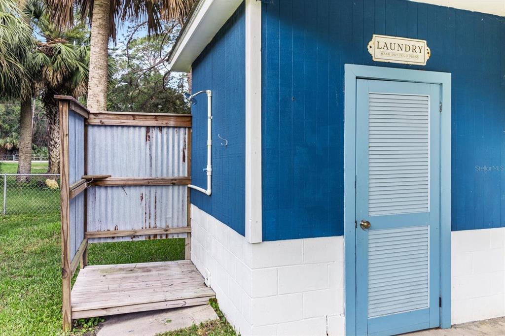7 65th Street Yankeetown, FL 34498 - Photo 29 of 43 a view of a porch with a door and wooden fence