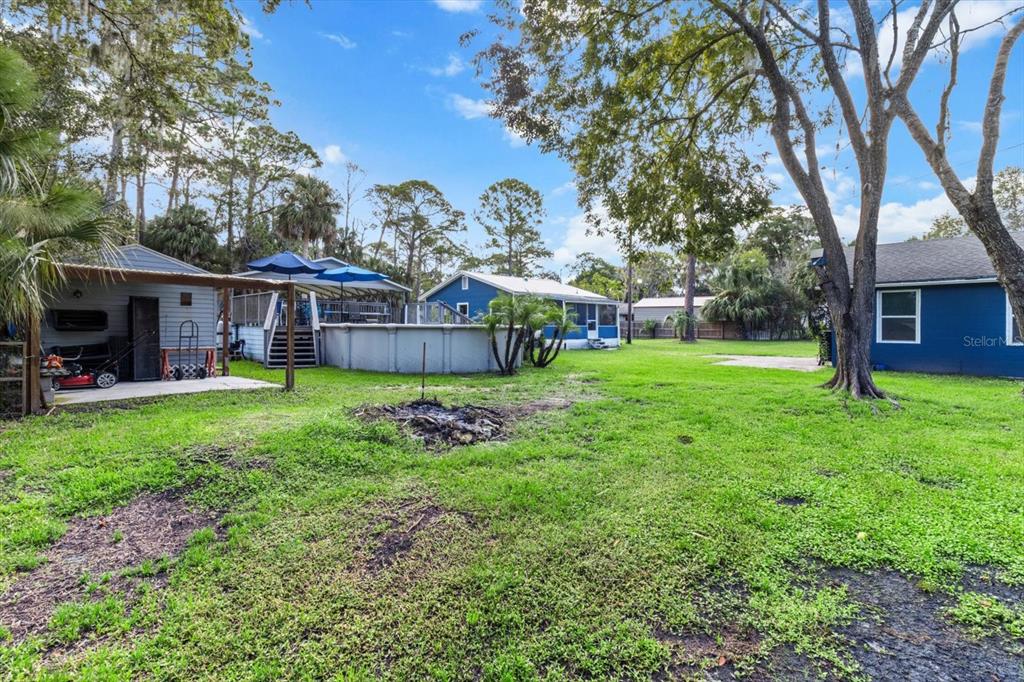 7 65th Street Yankeetown, FL 34498 - Photo 36 of 43 a view of a house with a big yard and large trees