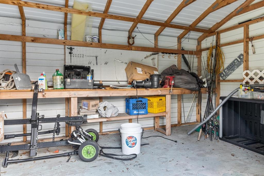 7 65th Street Yankeetown, FL 34498 - Photo 38 of 43 a utility room with stainless steel appliances a stove and cabinets