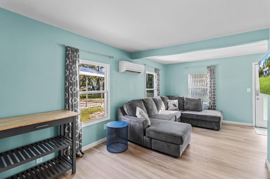 7 65th Street Yankeetown, FL 34498 - Photo 7 of 43 a living room with furniture and a window