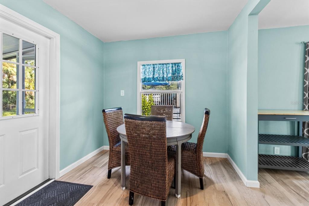 7 65th Street Yankeetown, FL 34498 - Photo 8 of 43 a view of a dining room with furniture window and wooden floor