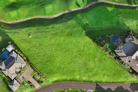 a backyard of a house with lots of green space