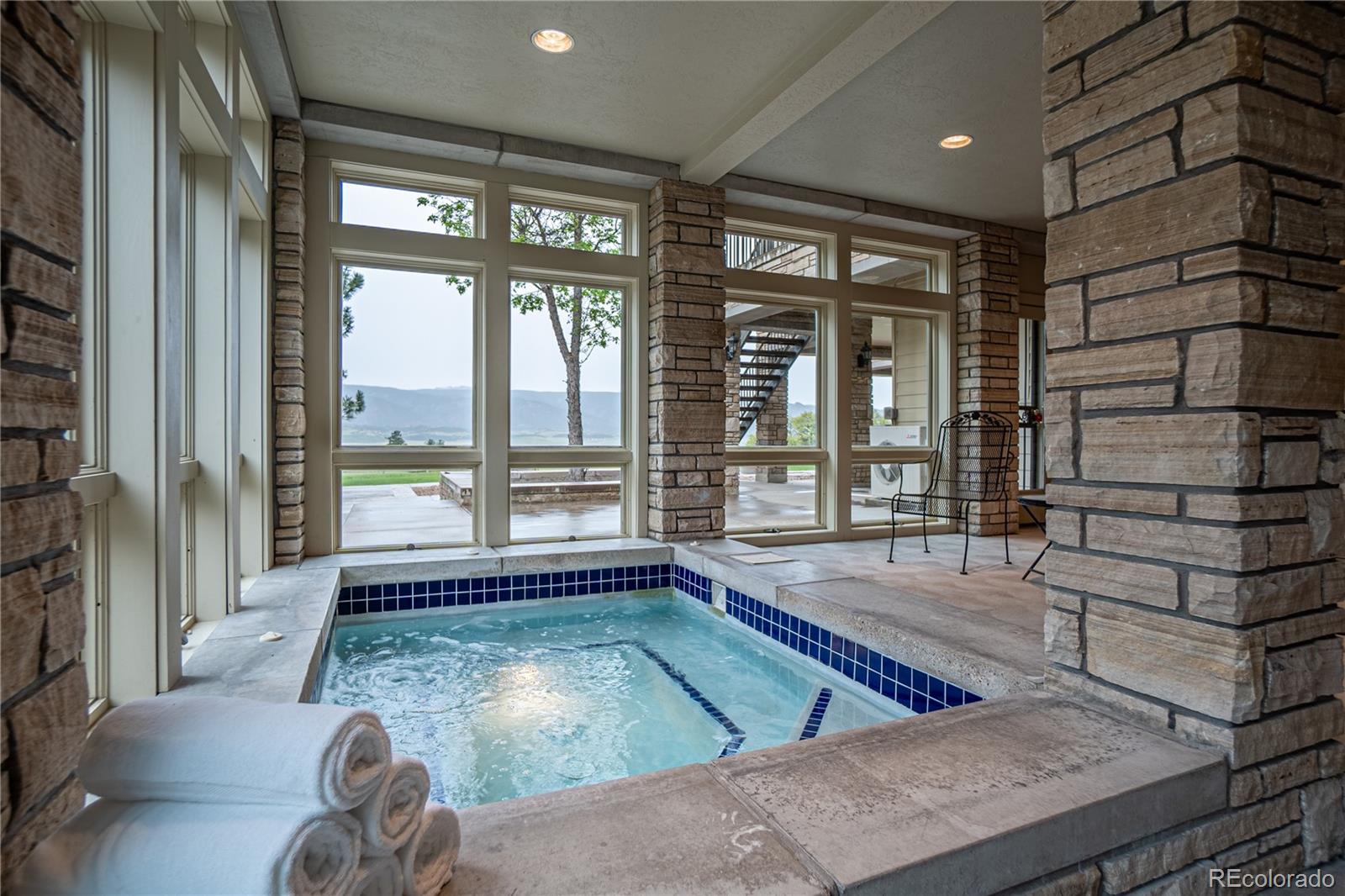 3282 Tomah Road Larkspur, CO 80118 - Photo 26 of 35 a room with pool table and windows