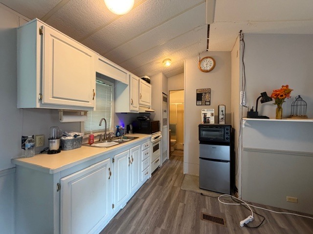 2795 East 28th Road Marseilles, IL 61341 - Photo 11 of 54 a kitchen with stainless steel appliances a sink stove and refrigerator