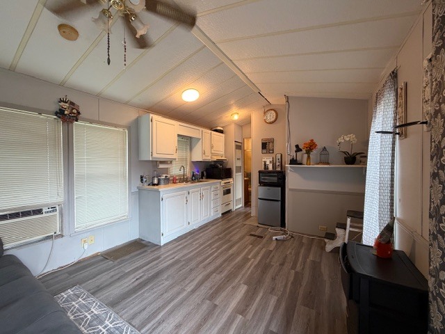 2795 East 28th Road Marseilles, IL 61341 - Photo 2 of 54 a kitchen with a refrigerator and white cabinets